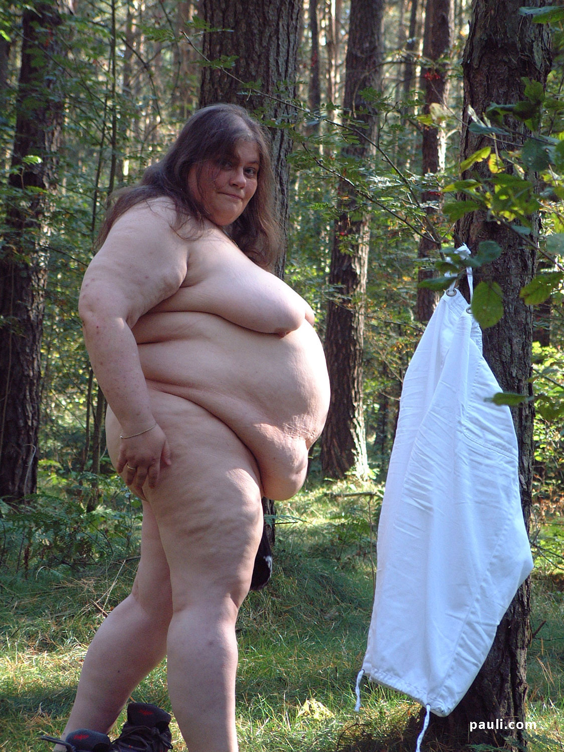 Fat naked MILF outdoors photo